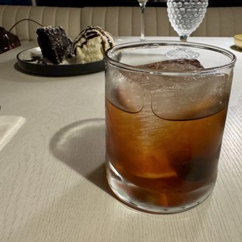 Akres - Underworld Manhattan, with a dessert photobombing the picture. - Mediterranean Near Me - Astoria, Oregon