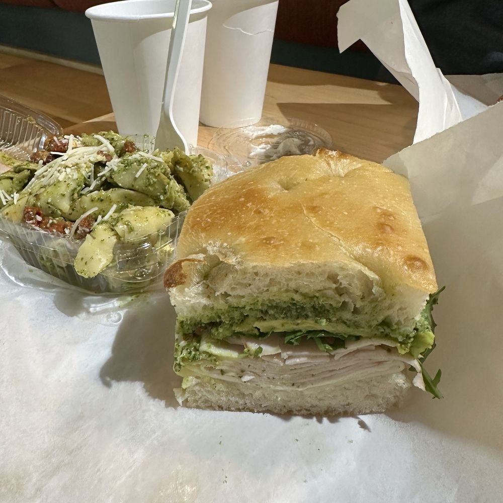 Avocado, turkey and pesto on focaccia bread with tortellini and pesto pasta salad Avocado, turkey and pesto on focaccia bread with tortellini and pesto pasta salad