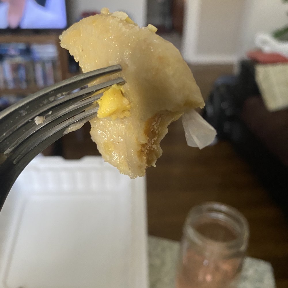 Top Taste - a fork with a piece of food on it - Caribbean Near Me - Irvington, New Jersey