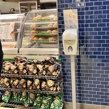 Subway Restaurants - a man standing in front of a display of donuts - Sandwiches Near Me - Jackson, Georgia Subway Restaurants - a man standing in front of a display of donuts - Sandwiches Near Me - Jackson, Georgia