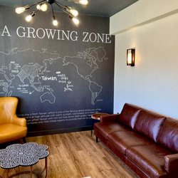 Comfy Seating area left of entrance & tea growing zone info