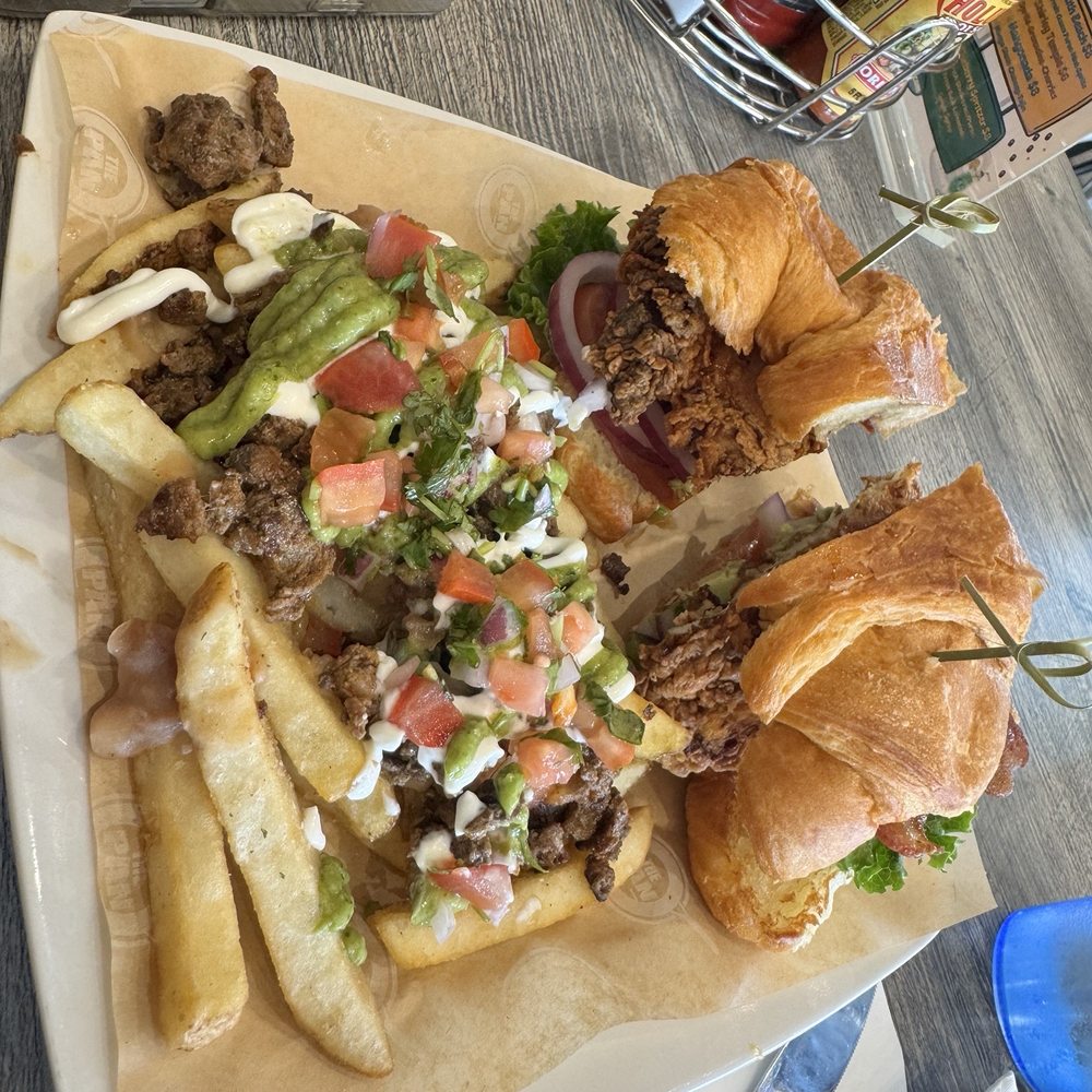The Pan - Fried chicken sandwich on croissant with upgraded carne asada fries - Breakfast & Brunch Near Me - Santa Ana, California The Pan - Fried chicken sandwich on croissant with upgraded carne asada fries - Breakfast & Brunch Near Me - Santa Ana, California