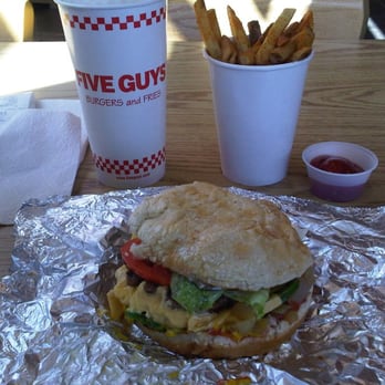 Five Guys - Cheese Burger with grilled onions, veggies, jalapenos, and condiments.  Cajun fries in the background. - Burgers Near Me - Phoenix, Arizona