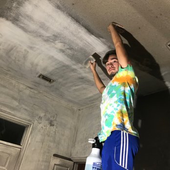 SKY-LAN Services - One of the Sky-Lan team removing soot by hand. Incredible! - Painters Near Me - Round Rock, Texas
