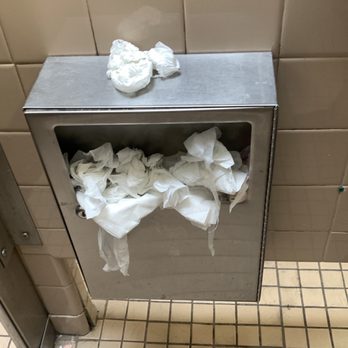yucca rest area - Overflowing female hygiene product bin inside women's bathroom stall - Rest Stops Near Me - Redlands, New Mexico