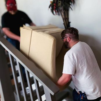 Trusty Trio - The team leaving a large cushioned chair up the stairs. - Movers Near Me - Greenwood, South Carolina Trusty Trio - The team leaving a large cushioned chair up the stairs. - Movers Near Me - Greenwood, South Carolina