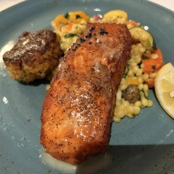 Cutters Crabhouse - King Salmon and crab cake special. Crab cake (left) was SO BAD. - Seafood Near Me - Seattle, Washington