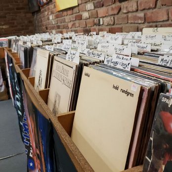 Stick It In Your Ear - Records on the back wall - Music & DVDs Near Me - Springfield, Missouri