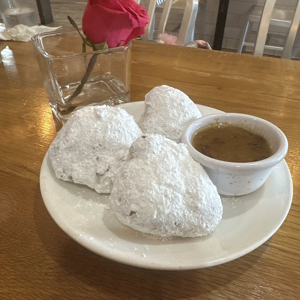 The Corner Grille - 3 Beignets with in house praline sauce. - Breakfast & Brunch Near Me - College Park, Georgia The Corner Grille - 3 Beignets with in house praline sauce. - Breakfast & Brunch Near Me - College Park, Georgia