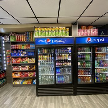 Cloud 16 Convenience - refrigeration area with refrigerated drinks - Vape Shops Near Me - New York, New York