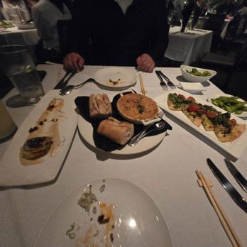 Roy's Waikiki - Pina colada, some roll with tempura in it, escargot, and salmon pita - Hawaiian Near Me - Honolulu, Hawaii