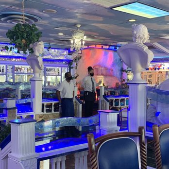 Hellas Restaurant - Decor, staff wearing masks - Bakeries Near Me - Tarpon Springs, Florida Hellas Restaurant - Decor, staff wearing masks - Bakeries Near Me - Tarpon Springs, Florida