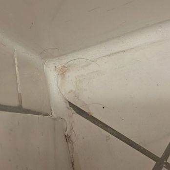 Marin Suites Hotel - Hair and stains in corner of bathroom - Hotels Near Me - Corte Madera, California