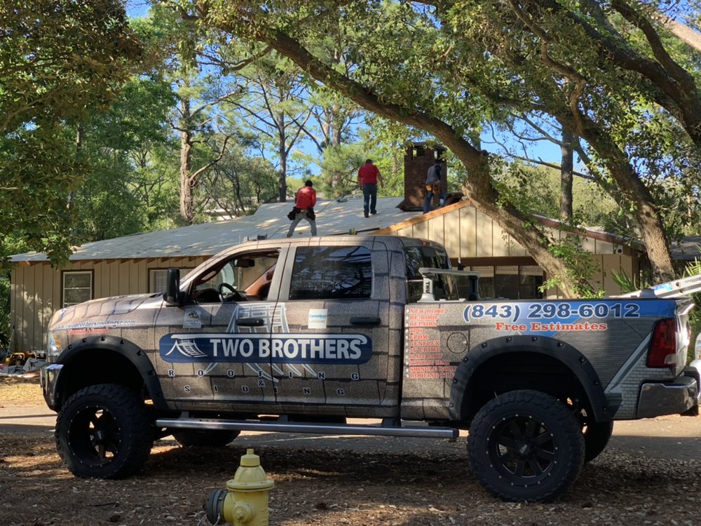 Slide of Two Brothers Roofing