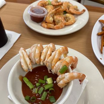 Shrimp N Stuff Downtown - Shrimp cocktail from Happy Hour menu. In the background is the boiled shrimp from the main menu. - Seafood Near Me - Galveston, Texas Shrimp N Stuff Downtown - Shrimp cocktail from Happy Hour menu. In the background is the boiled shrimp from the main menu. - Seafood Near Me - Galveston, Texas
