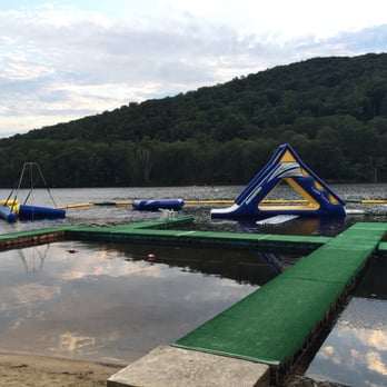 Club Getaway - lake at campsite with water slide and giant floats - Recreation Centers Near Me - Kent, Connecticut Club Getaway - lake at campsite with water slide and giant floats - Recreation Centers Near Me - Kent, Connecticut