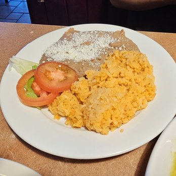 Ely’s Restaurant - Rice and beans that came with the chicken enchiladas - Breakfast & Brunch Near Me - Henderson, Nevada Ely’s Restaurant - Rice and beans that came with the chicken enchiladas - Breakfast & Brunch Near Me - Henderson, Nevada