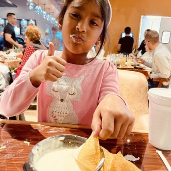 Los Agaves Grill - Daughter with chips queso dip - Bars Near Me - Westfield, Indiana Los Agaves Grill - Daughter with chips queso dip - Bars Near Me - Westfield, Indiana