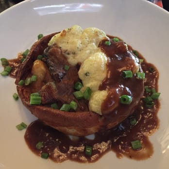 The Pint Public House - Beef stew with Yukon potatoes in a Yorkshire pudding - Sports Bars Near Me - Edmonton, Alberta