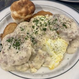 Biscuits and gravy over 2 eggs, potatoes and onions Biscuits and gravy over 2 eggs, potatoes and onions
