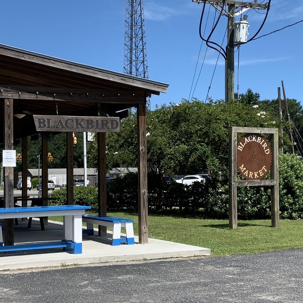 Blackbird Market - a blue picnic table in front of a building - Farmers Market Near Me - Johns Island, South Carolina