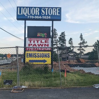Package Depot - a liquor store sign on the side of the road - Beer, Wine & Spirits Near Me - Fairburn, Georgia Package Depot - a liquor store sign on the side of the road - Beer, Wine & Spirits Near Me - Fairburn, Georgia