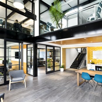 Haycon - a large open plan office with a staircase leading up to the second floor - General Contractors Near Me - Boston, Massachusetts Haycon - a large open plan office with a staircase leading up to the second floor - General Contractors Near Me - Boston, Massachusetts