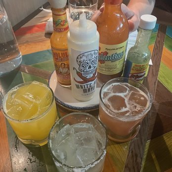 Anejo - Variety of sauces that come with the tacos (top).  Margaritas: mango (left), ginger (middle), blood orange (right) - Bars Near Me - Toronto, Ontario