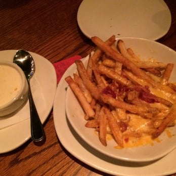 Outback Steakhouse - Aussie cheese fries...wait a minute let me taste...definitely worth the calories - Steakhouses Near Me - Saginaw, Michigan Outback Steakhouse - Aussie cheese fries...wait a minute let me taste...definitely worth the calories - Steakhouses Near Me - Saginaw, Michigan