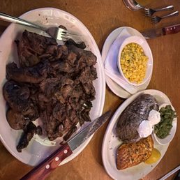 Porterhouse medium rare with mushrooms and corn. Wife got 8oz salmon with baked potato