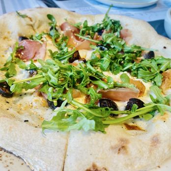 Sixty Vines - FIG & PROSCIUTTO white sauce, mozzarella, honey, arugula, sesame seeds - New American Near Me - Nashville, Tennessee Sixty Vines - FIG & PROSCIUTTO white sauce, mozzarella, honey, arugula, sesame seeds - New American Near Me - Nashville, Tennessee