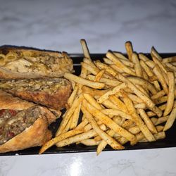Honey Drizzle - Appetizer egg rolls with fries steak and cheese as well as mac n cheese jerk chicken with fries. So amazing  10/10