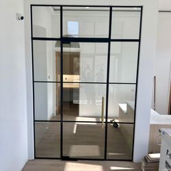 Sunset Glass - Grid design office door with matte black finish. 
Designed by Sunset Glass.