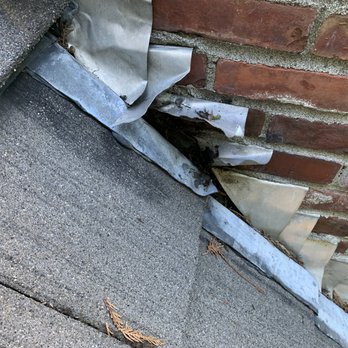 Red Rock Roofing - BEFORE - Deteriorated/damaged chimney flashing - Roofing Near Me - Renton, Washington Red Rock Roofing - BEFORE - Deteriorated/damaged chimney flashing - Roofing Near Me - Renton, Washington