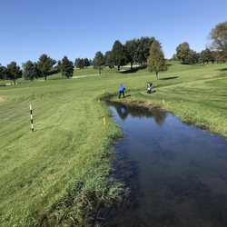 Southern Hills Golf Club - My golf partner trying to hit out of water at Southern Hills.