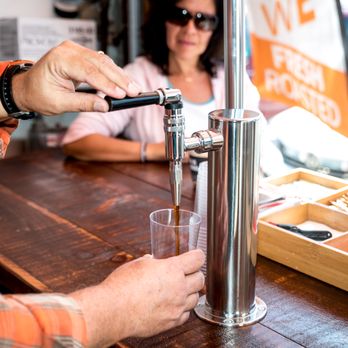 East Coast Roast - a person pouring a glass of beer - Coffee Roasteries Near Me - Island Park, New York East Coast Roast - a person pouring a glass of beer - Coffee Roasteries Near Me - Island Park, New York