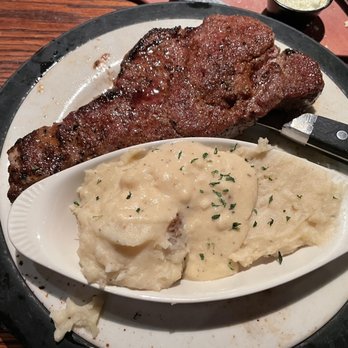 Ruby River Steakhouse - 16oz rib-eye cooked medium rare with garlic mashed potatoes - Steakhouses Near Me - Reno, Nevada