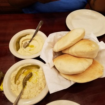 Afrah Restaurant - Baba ghanoush (bottom), Hummas (top) and bread (left). - Mediterranean Near Me - Richardson, Texas Afrah Restaurant - Baba ghanoush (bottom), Hummas (top) and bread (left). - Mediterranean Near Me - Richardson, Texas