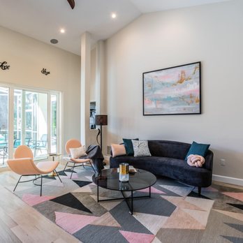 Bath & Kitchen Gallery - a living room with a couch, chairs, a coffee table, and a television - General Contractors Near Me - Tampa, Florida Bath & Kitchen Gallery - a living room with a couch, chairs, a coffee table, and a television - General Contractors Near Me - Tampa, Florida