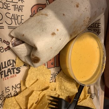 Tijuana Flats - Tijuana Burrito with a side of queso - Mexican Near Me - Gainesville, Florida Tijuana Flats - Tijuana Burrito with a side of queso - Mexican Near Me - Gainesville, Florida