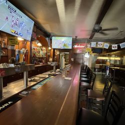 Doghouse Sports Lounge - One half the bar.