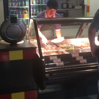 Hot Rice - a man standing in front of a buffet - Restaurants Near Me - Defiance, Ohio Hot Rice - a man standing in front of a buffet - Restaurants Near Me - Defiance, Ohio