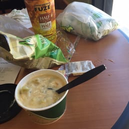 a bowl of soup and a cup of soup on a table a bowl of soup and a cup of soup on a table