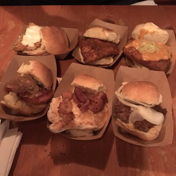 Green Dot Stables - Sliders top row: Catfish, Fried Chicken, Pork Belly Schnitzel. Bottom row: Fried Bologna, Hot Brown, Mystery Meat (Buffalo) - Bars Near Me - Detroit, Michigan Green Dot Stables - Sliders top row: Catfish, Fried Chicken, Pork Belly Schnitzel. Bottom row: Fried Bologna, Hot Brown, Mystery Meat (Buffalo) - Bars Near Me - Detroit, Michigan