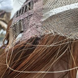 Damaged lace, no brand labeling, worn clips, unfinished seams.