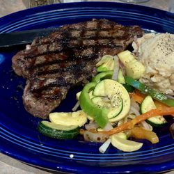 New York cut steak potatoes and vegetables