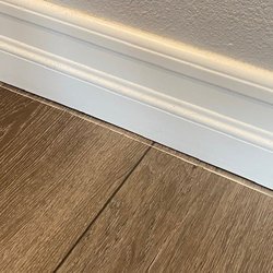 TRS Tile - Paint line on the floor where the baseboard has settled