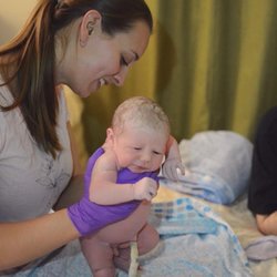 Snohomish Midwives - Midwife and Owner Siri Larson Iverson offering this newly born baby their first exam!