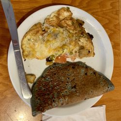 Jeannie's Great Maine Breakfast - Half a skillet and half a blueberry pancake.