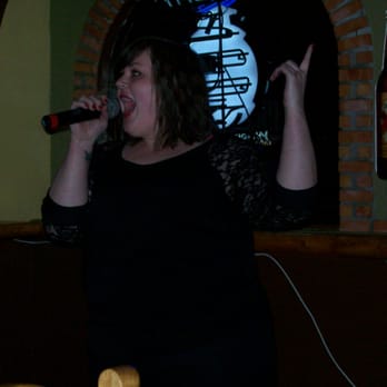 Absolute Karaoke Entertainment Group - a woman singing into a microphone - Karaoke Near Me Absolute Karaoke Entertainment Group - a woman singing into a microphone - Karaoke Near Me